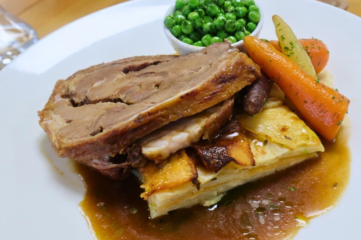 Lamb Shoulder And Potato Gratin With Minted Peas And Chanteney Carrots